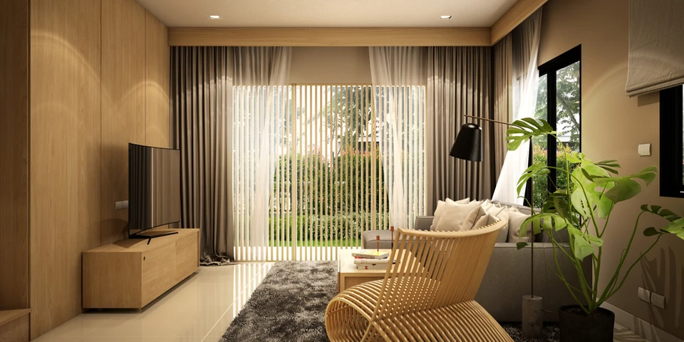 Salon moderne avec mobilier en bois clair, canapé gris, fauteuil design et plantes vertes